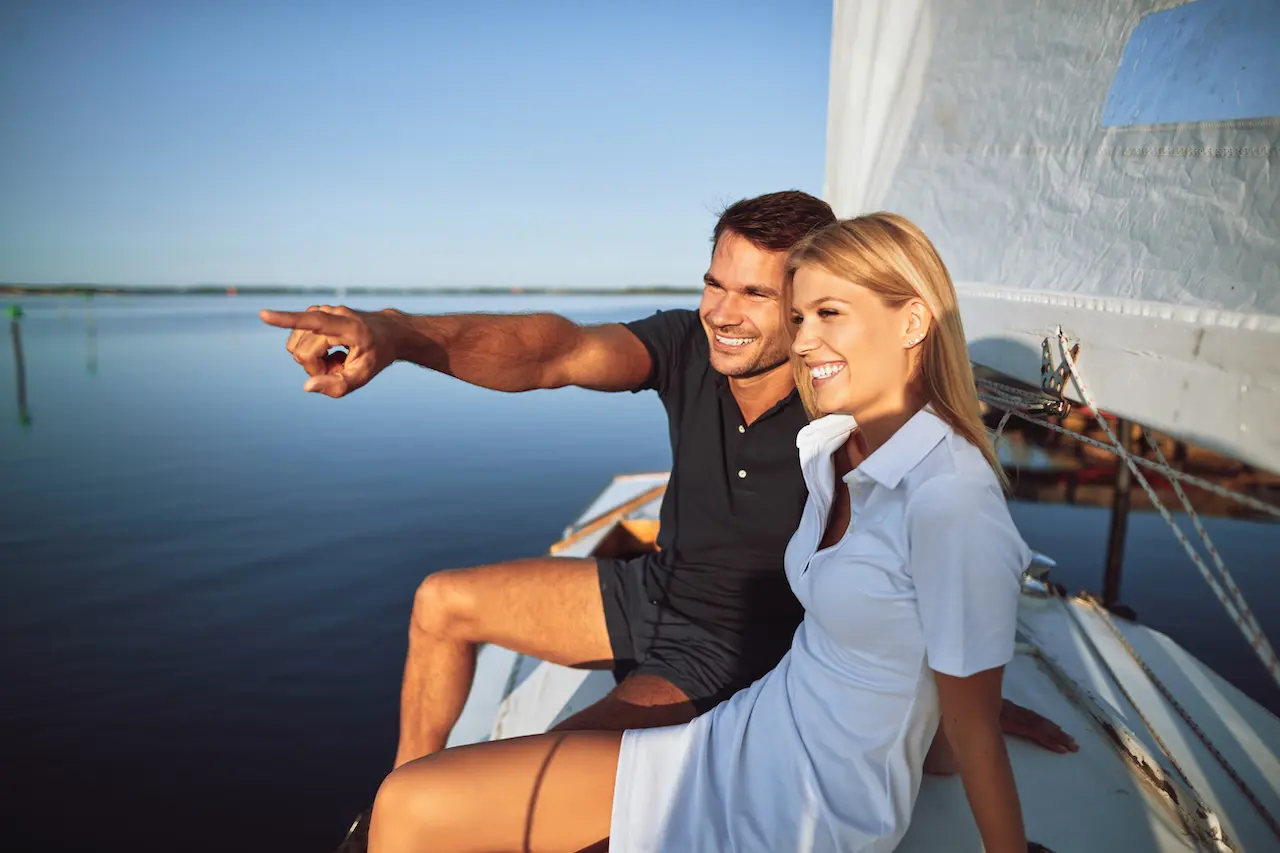 A friendly couple sitting on a sail boat